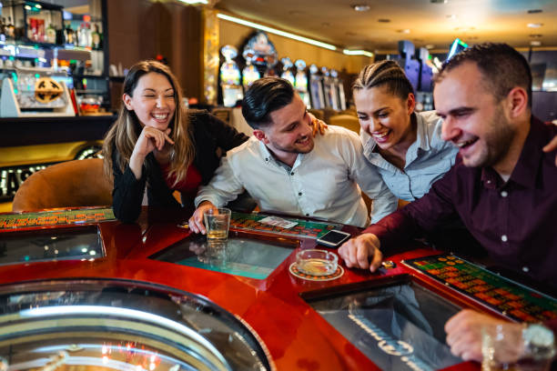 Live dealer at k9win American Roulette table with HD camera angles showing the spinning wheel